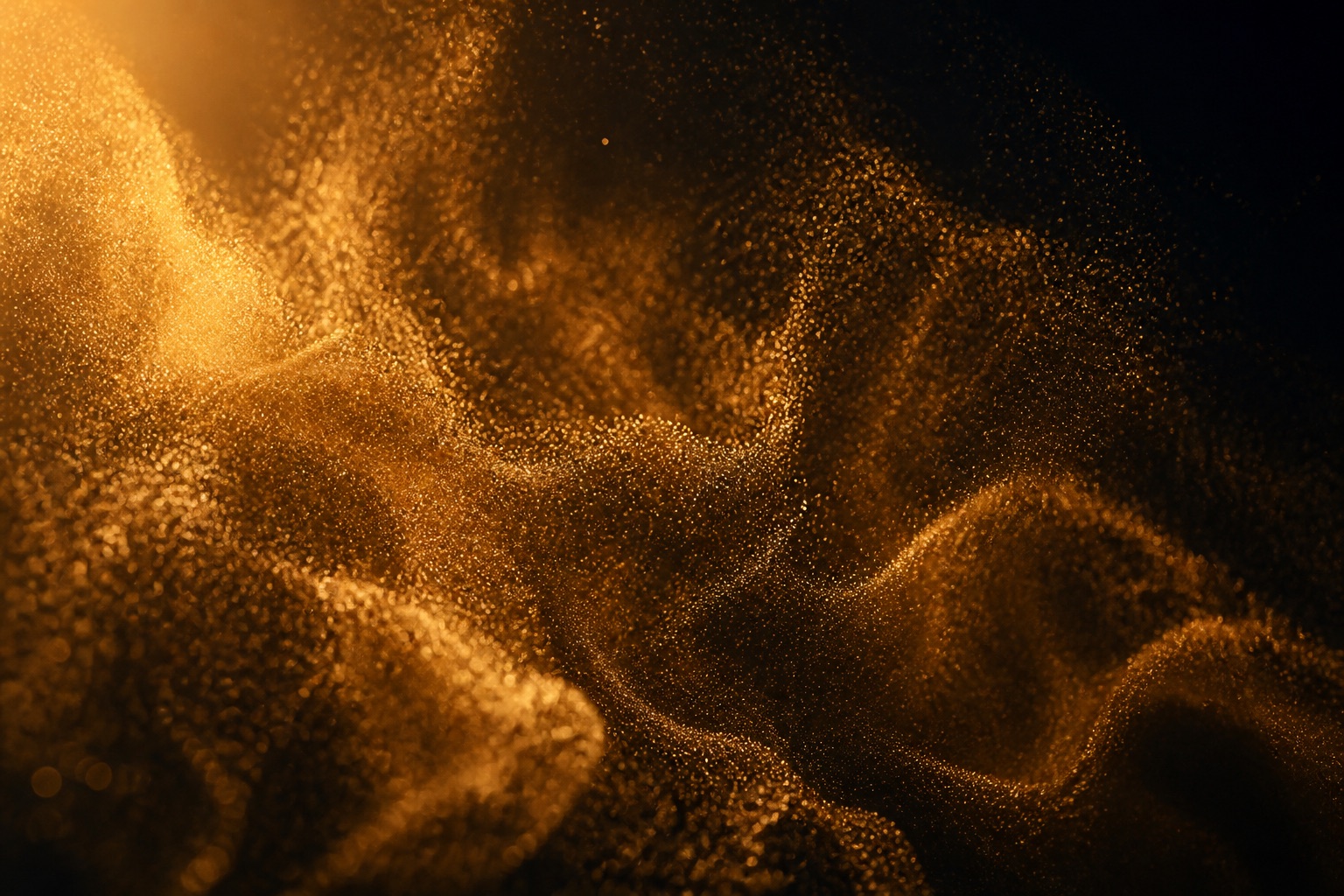 Bronze dust on graphite, lit from one side.